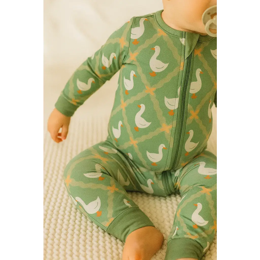 Green baby sleeper with white goose and trellis pattern in Silly Goose Bamboo Baby Sleeper