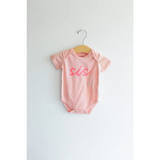 Pink sis organic cotton onesie for baby sister making her debut in style