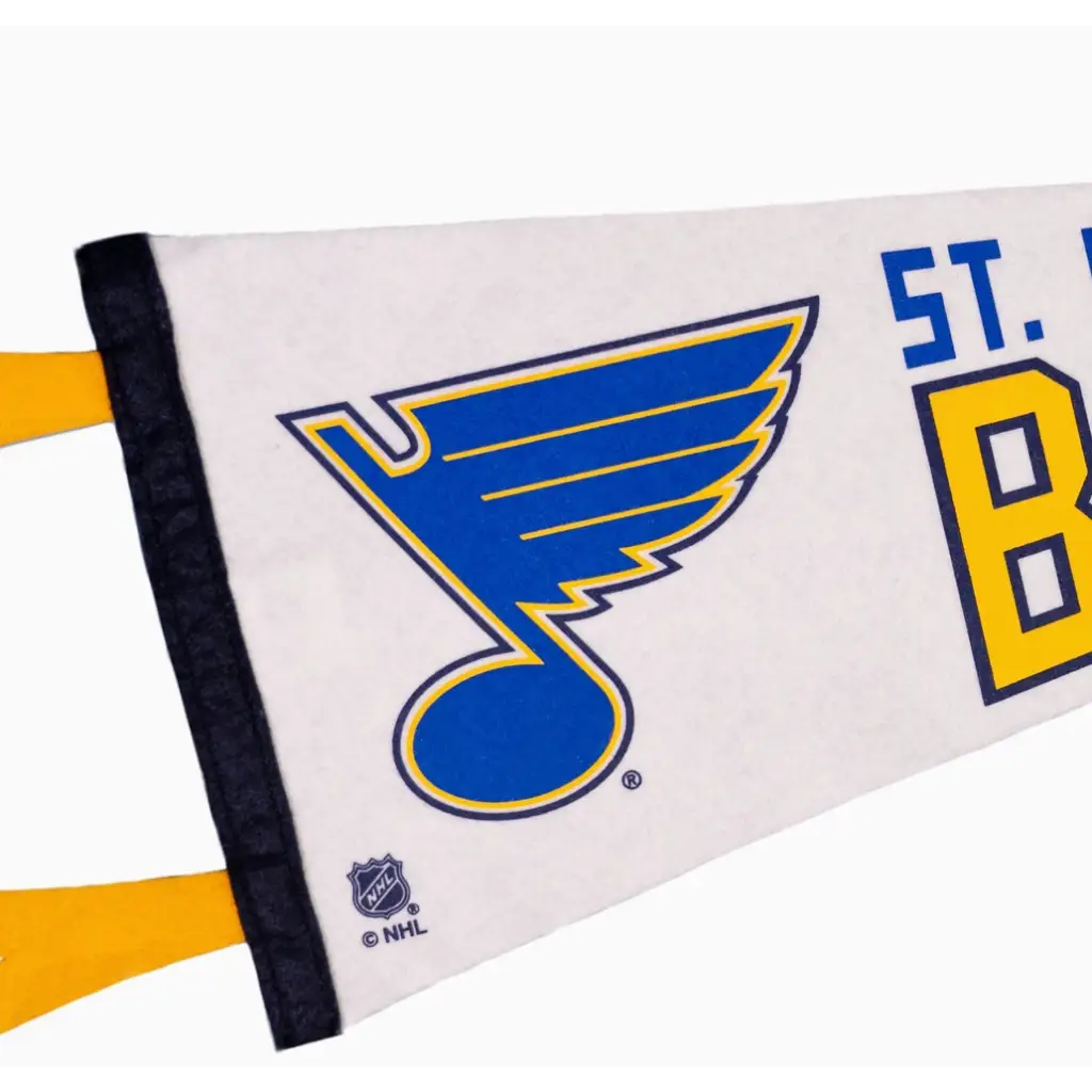 NHL St. Louis Blues pennant showcasing the team’s blue musical note logo on a navy sofa