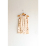 Sleeveless beige pocket playsuit with floral print for the ultimate summer vibe