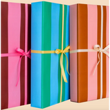 Three colorful wrapped gift boxes on Cute Pink and Brown Modern Wrapping Paper