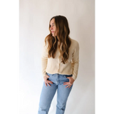 Casual outfit showing the Annie Cardigan Sweater with light-wash jeans and cream colors