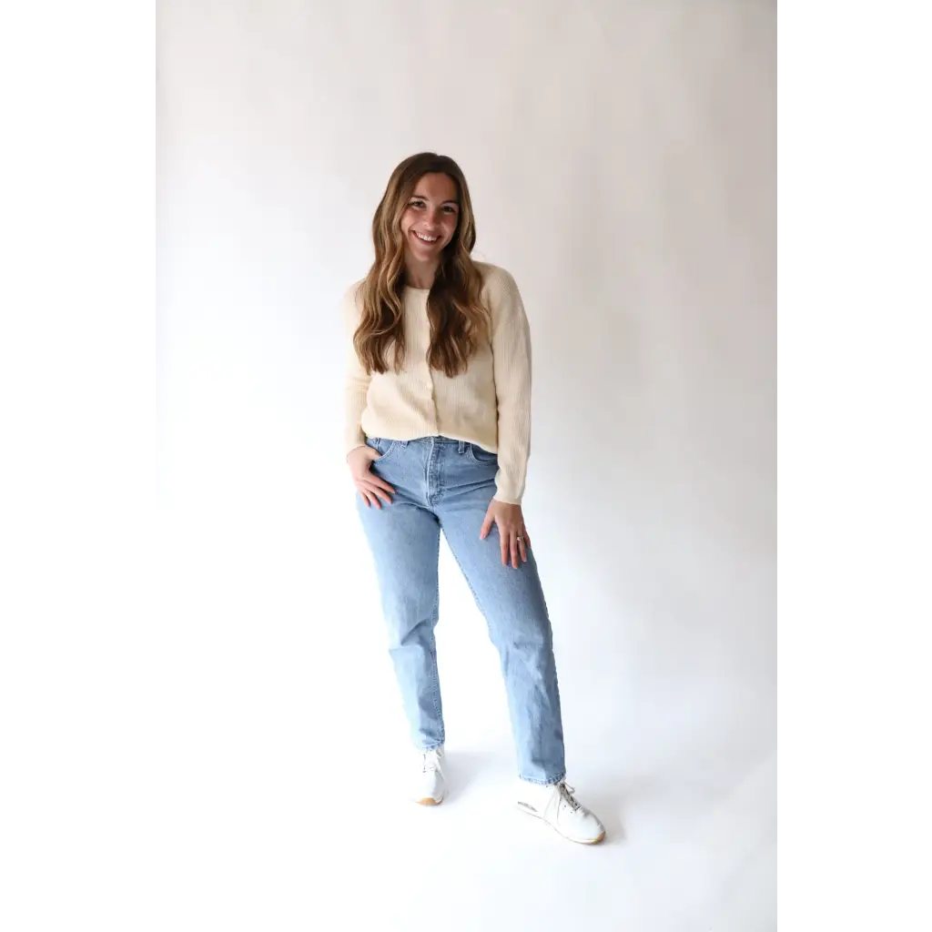 Light-wash mom jeans, cream sweater, and white sneakers with Annie Cardigan Sweater