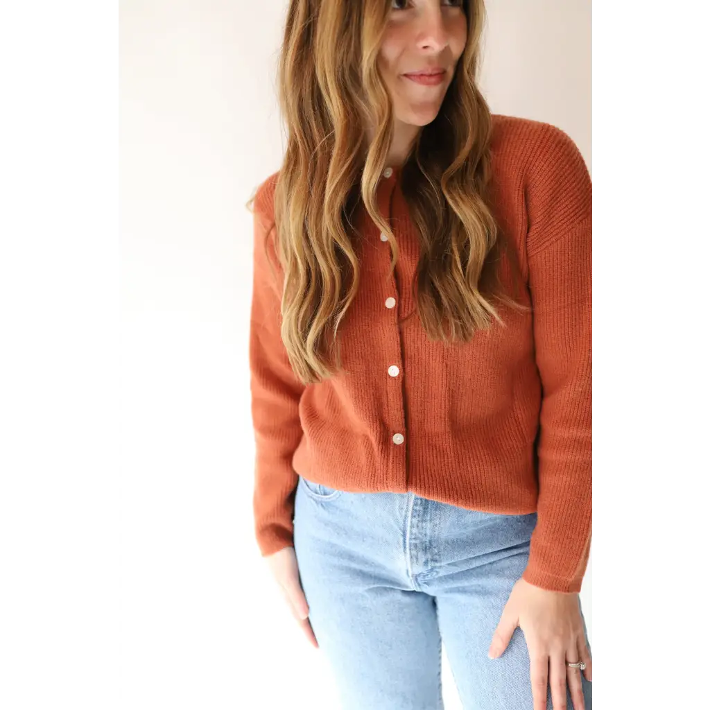 Rust-colored Annie Cardigan Sweater with pearl buttons for effortless style