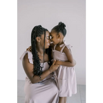 Parent and child share a sweet moment in the Lilac Day Dress with Ruffled Straps
