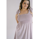 Lavender smocked sundress with shoulder ties perfect for a stylish day dress look