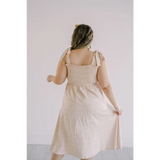 Beige day dress with shoulder ties and smocked bodice, perfect for sunny days