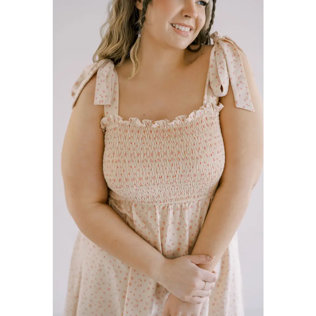 Beige floral mini day dress with shoulder ties and smocked bodice for sunny outings