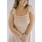 Beige floral mini day dress with shoulder ties and smocked bodice for sunny outings
