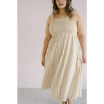 Striped day dress with smocked bodice and spaghetti straps for a chic summer look