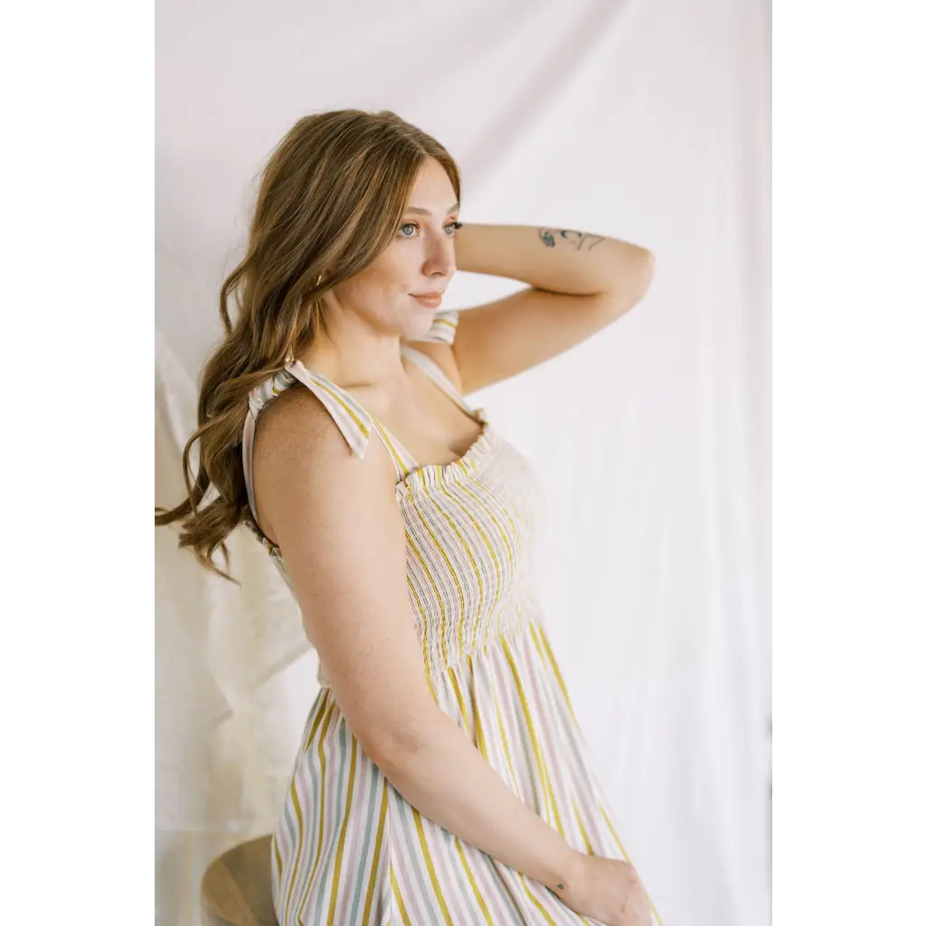 Striped Day Dress with Smocked Bodice, perfect for sunny days and polished prints