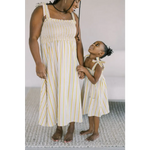Matching striped sundresses with yellow accents perfect for a stylish day dress outing