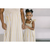 Matching yellow and white striped day dresses with shoulder ties for a chic summer look