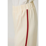 Cream tracksuit pants with red stripes, elastic waistband, cotton-polyester blend, stylish look