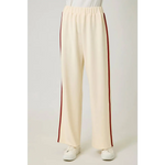 Cream tracksuit pants with red side stripes and elastic waistband for a casual look