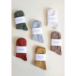 Soft and flexible everyday sock collection in muted earth tones and olive green ribbed design