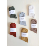Soft and flexible everyday sock collection in muted earth tones and olive green ribbed design