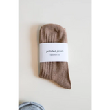 Beige ribbed cotton sock with label, perfect for soft and flexible everyday wear