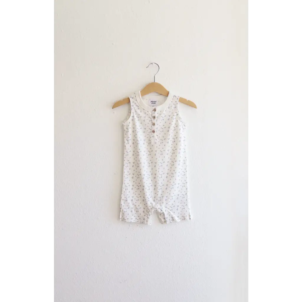 White floral sleeveless Henley romper hanging for Babies in super soft organic cotton