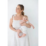 Mother and baby in matching white eyelet dresses with super soft organic cotton henley romper