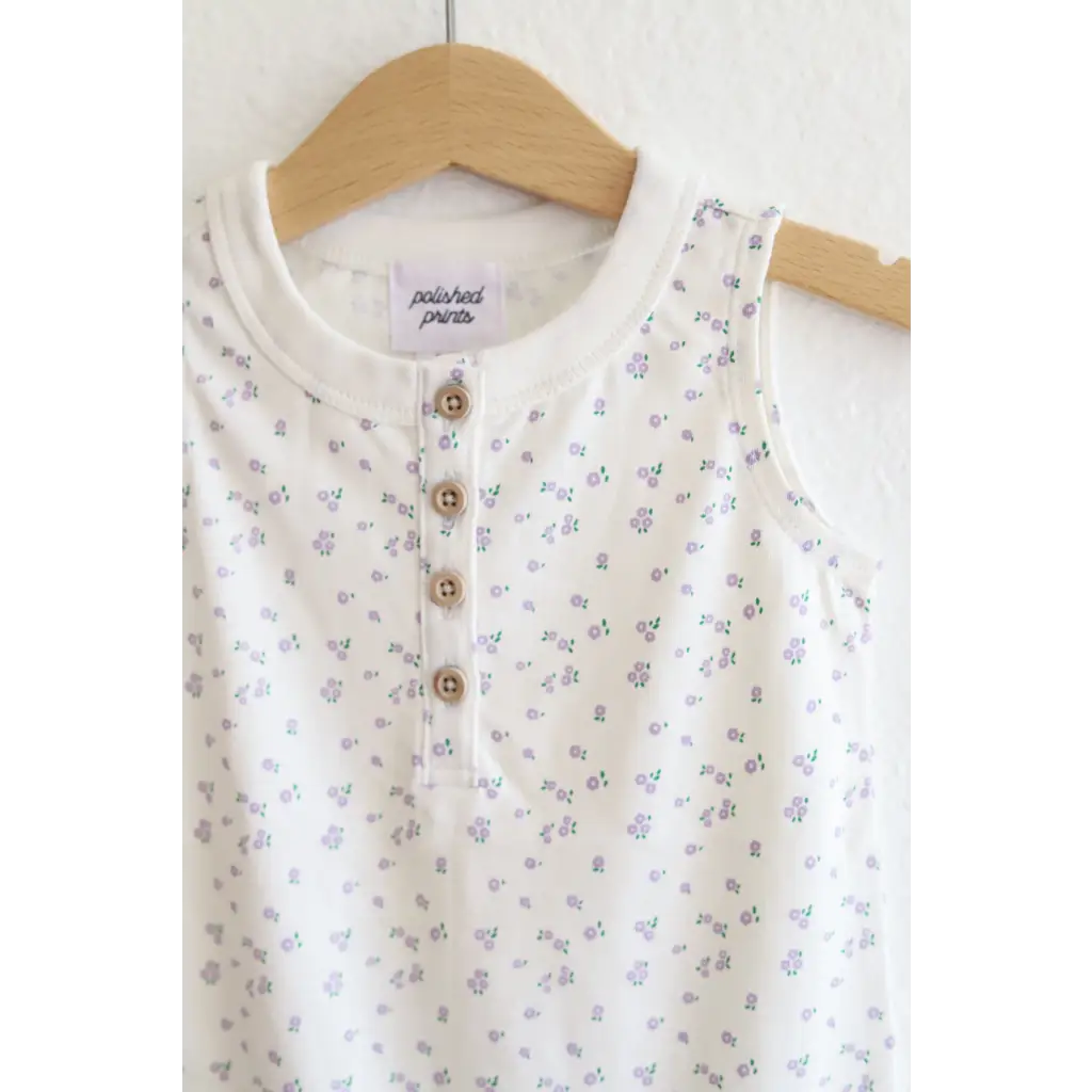 White sleeveless top with floral print on a super soft Organic Cotton Henley Romper for babies
