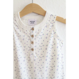 White sleeveless top with floral print on a super soft Organic Cotton Henley Romper for babies