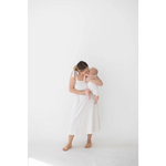 Tender parent-baby moment in super soft organic cotton Henley romper with floral print