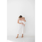 Tender parent-baby moment in super soft organic cotton Henley romper with floral print