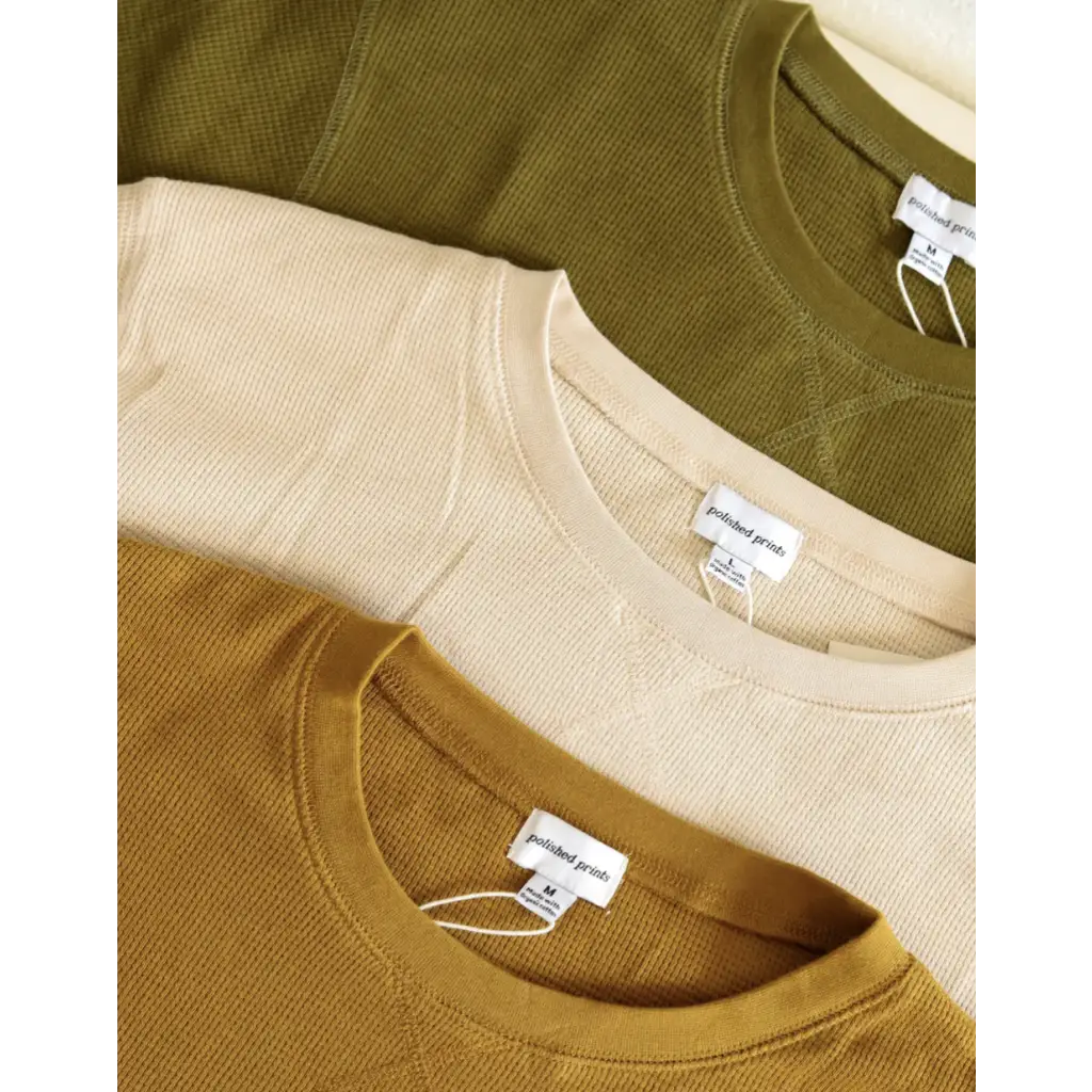 Three cozy Jenna Knitted Waffle Longsleeve Pullovers in olive green, cream, and caramel