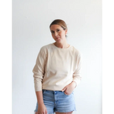 Cream-colored Jenna Knitted Waffle Longsleeve Pullover with ribbed cuffs for cozy vibes