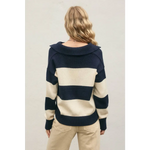 Woman wearing The Lana Striped Polo Sweater with relaxed fit and polished prints
