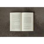 Open white book with black text on pages from The Life That’s Waiting, stylish womens clothes