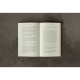 Open white book with black text on pages from The Life That’s Waiting, stylish womens clothes