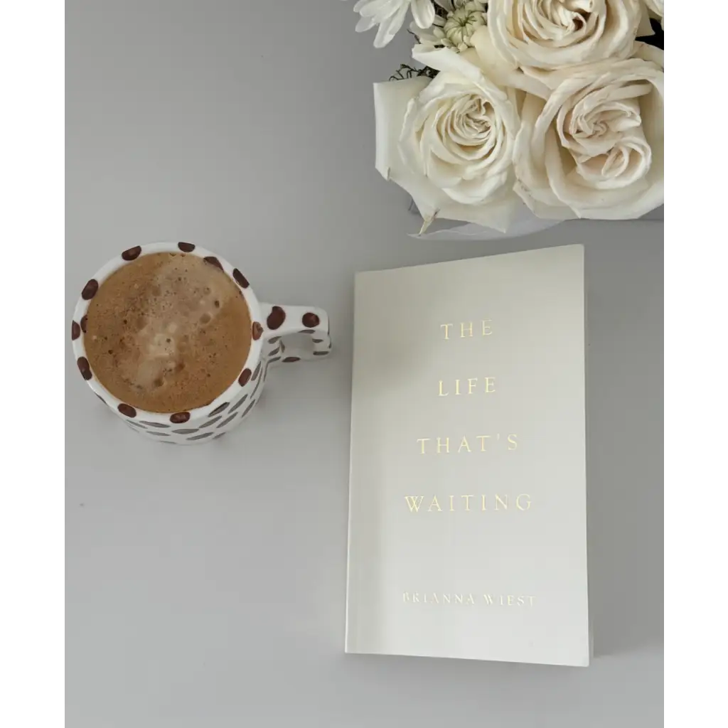 White ceramic mug with coffee bean design and latte from The Life Thats Waiting