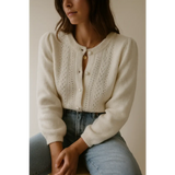 Cream-colored The Luxe Pointelle Henley Sweater with puffed sleeves and openwork detail featuring three peace signs for Peace Signs Camp flag style