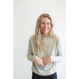 Blonde person in a Margo Crew Neck Sweater in Light Beige with Ribbed Details