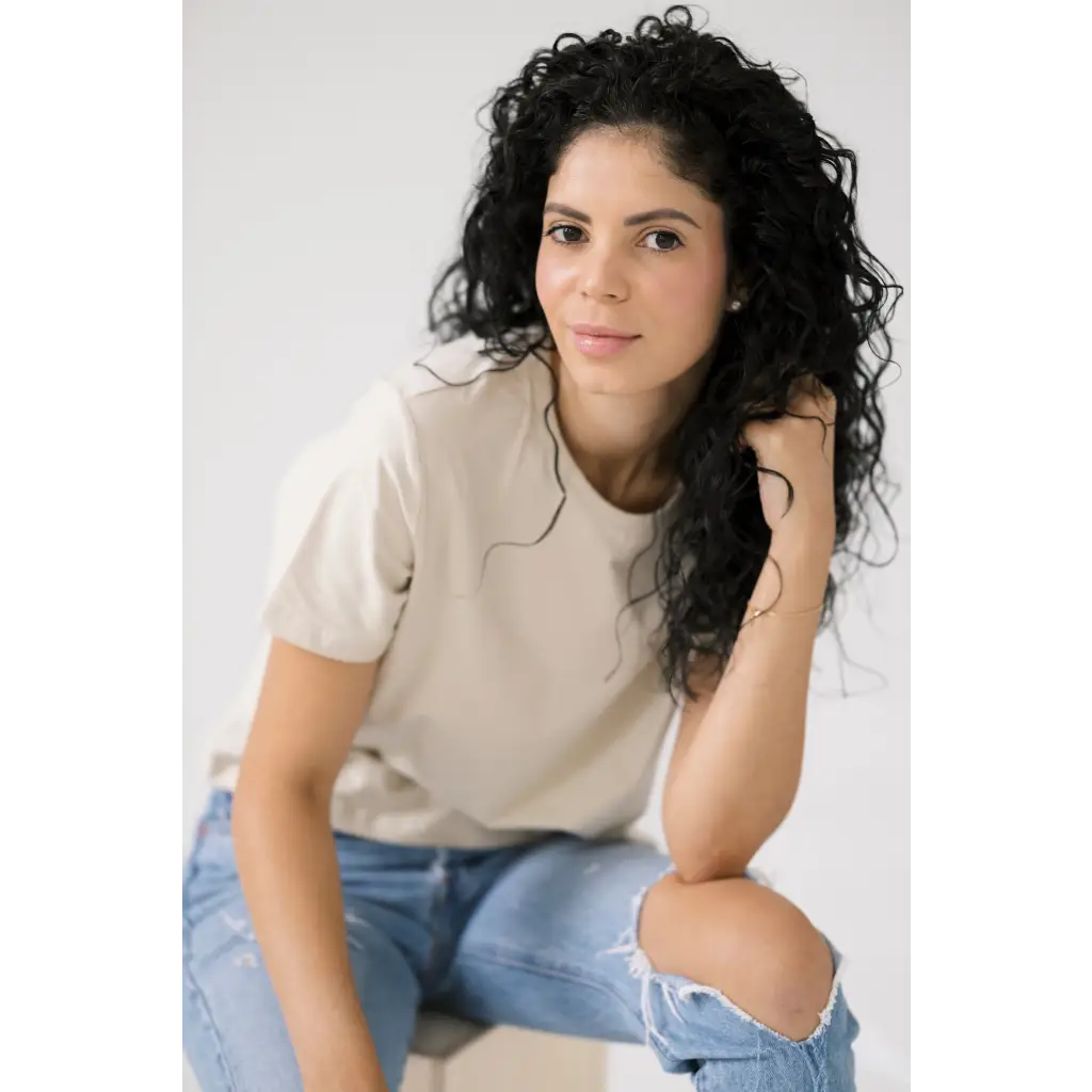 Person in beige Mom Crop Tee in Bone White with ripped jeans for a polished look