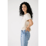 Person in a white Mom Crop Tee and light blue jeans for a chic, polished look