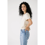 Person in a white Mom Crop Tee and light blue jeans for a chic, polished look