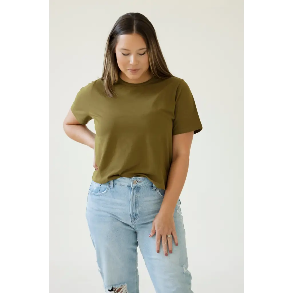 Olive green boxy tee designed for moms styled with light wash distressed jeans