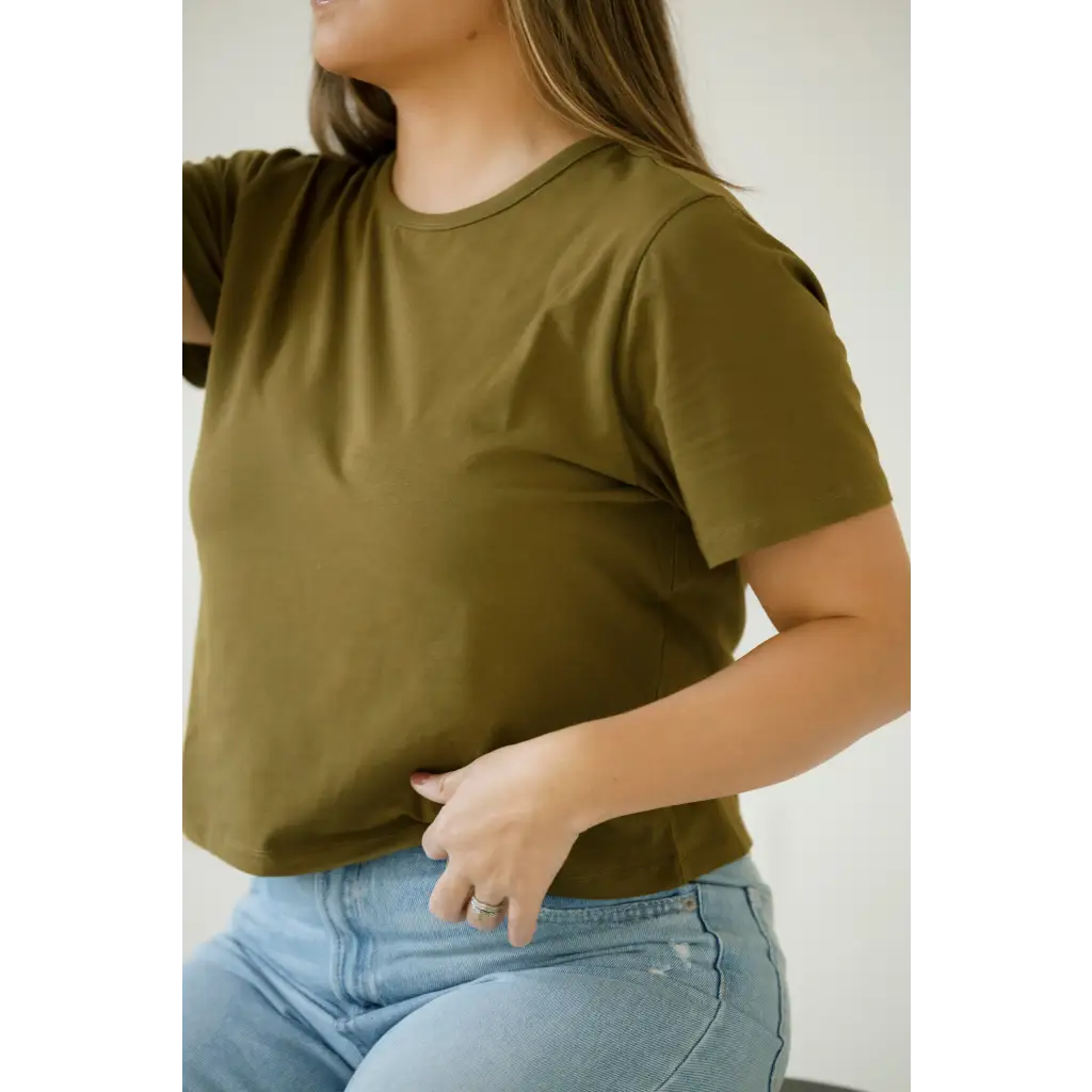 Olive green mom crop boxy tee styled with light blue jeans for a casual vibe