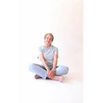 Seated older woman in The Mom Crop Sky showcasing stylish womens clothes with polished prints