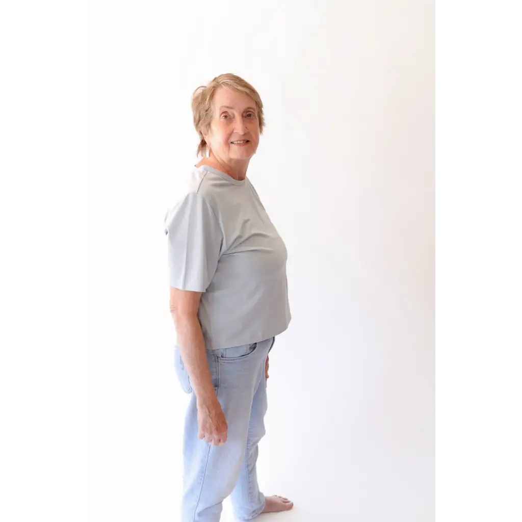Older woman in casual stylish womens clothes wearing The Mom Crop in Sky with polished prints
