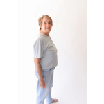 Older woman in casual stylish womens clothes wearing The Mom Crop in Sky with polished prints