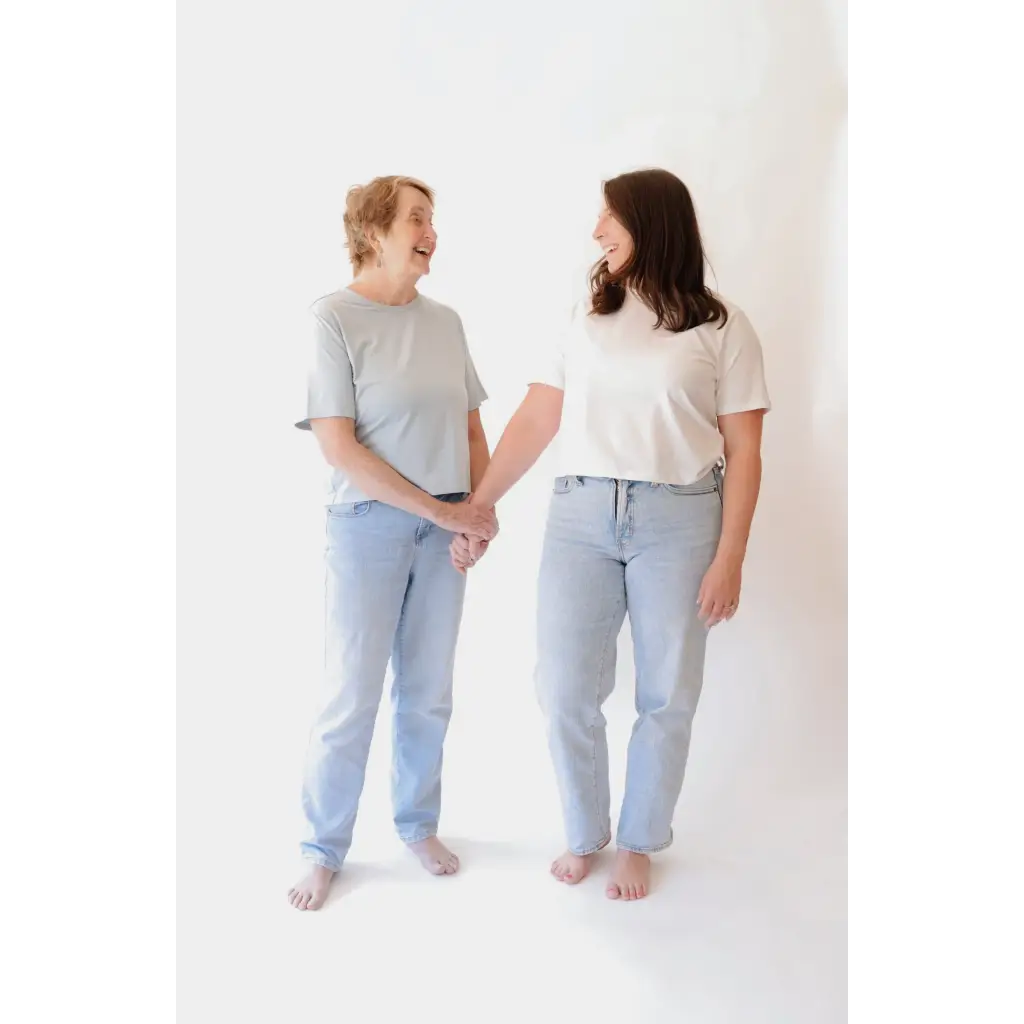 Two women holding hands wearing The Mom Crop in Sky, stylish womens clothes and polished prints