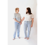 Two women holding hands wearing The Mom Crop in Sky, stylish womens clothes and polished prints