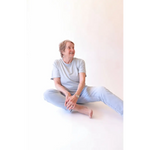 Elderly woman in casual stylish womens clothes wearing The Mom Crop in Sky with polished prints