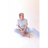 Elderly woman in casual stylish womens clothes wearing The Mom Crop in Sky with polished prints