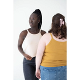 Two people in casual tank tops showcasing the Mustard Yellow Mom Tank for stylish womens clothes