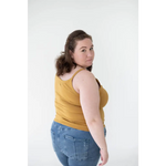 Person rocking a Mustard Yellow Mom Tank Top with blue jeans, perfect for stylish womens clothes